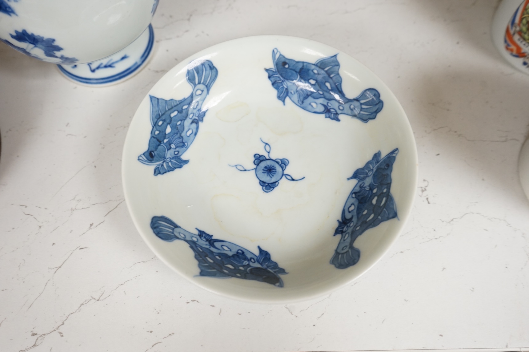 A Chinese blue and white vase and a ‘fish’ saucer dish, largest 19cm high